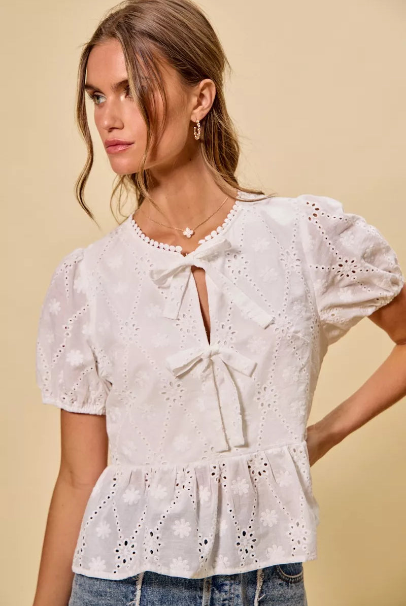 Women’s boutique eyelet embroidered top from Thread Bar Boutique crafted in breathable cotton with structured fit.