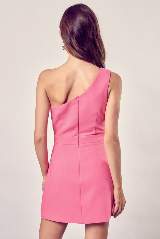 Woman wearing a sleek one-shoulder asymmetrical dress with a modern fit, perfect for events or parties