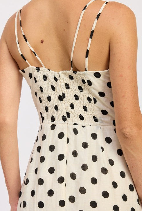 Flowy maxi dress with classic polka dot print and fitted bodice smocked back and zipper. Thread Bar Boutique