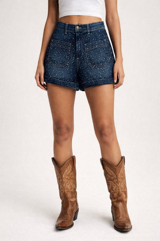 Rhinestone embellished denim shorts from Thread Bar Boutique featuring relaxed fit, rolled cuff hem, and western-inspired sparkle for concerts and summer outfits.