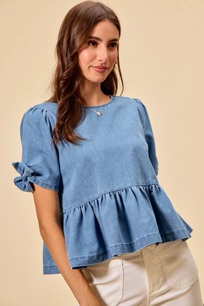 Casual denim peplum top with feminine bow accent from Thread Bar Boutique puff sleeve
