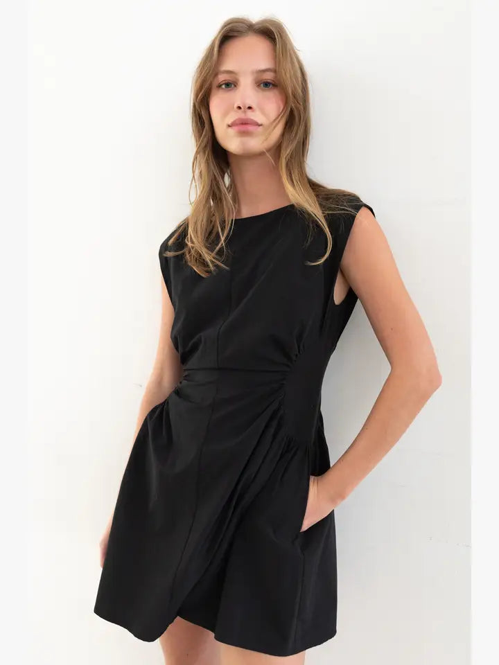 Cap Sleeve black short dress with side ruching front view with pockets