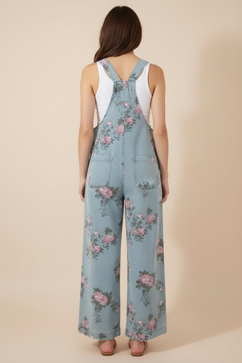Vintage-inspired floral denim overalls at Thread Bar Boutique with pleated waist and feminine pink and sage print.