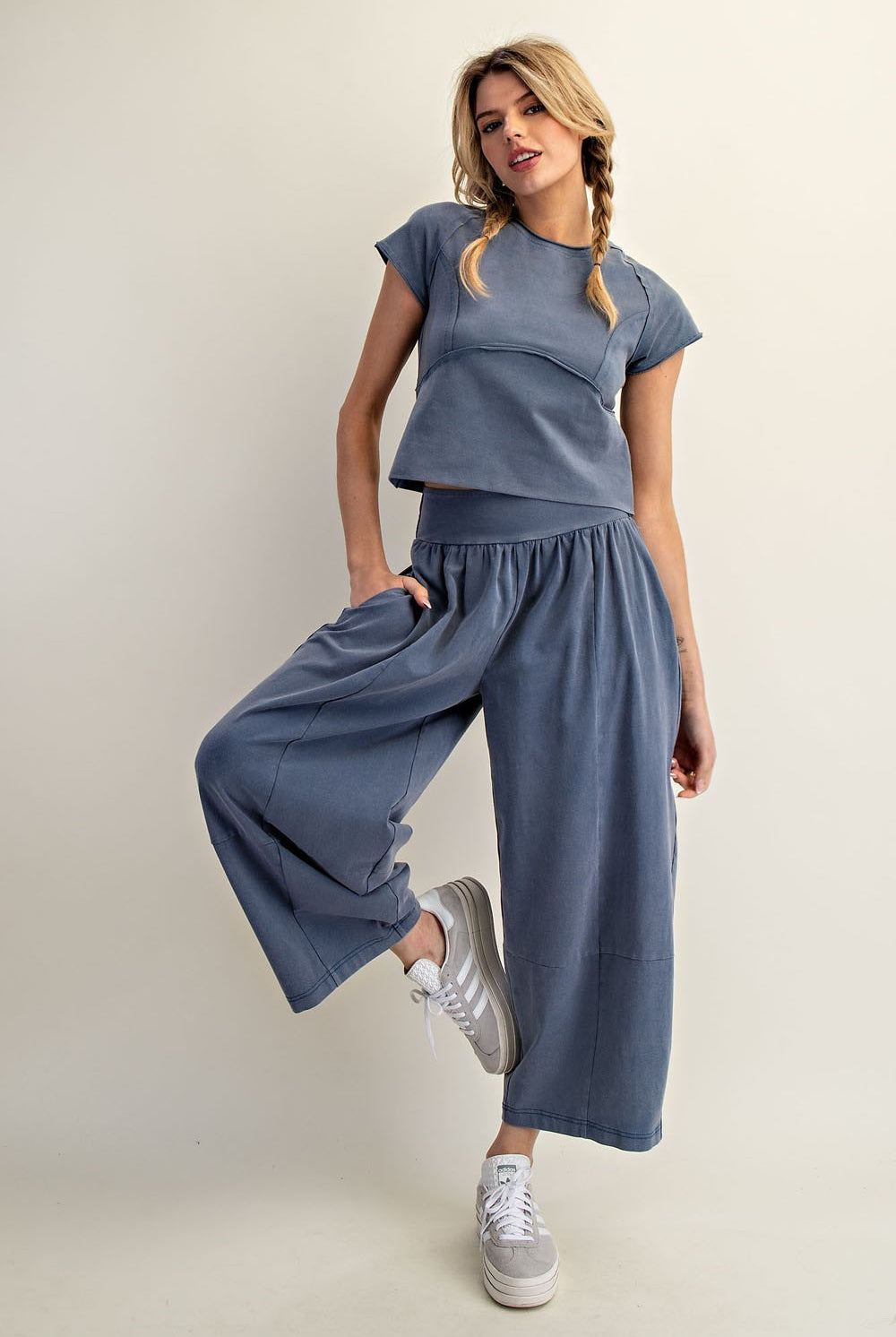 Front view of mineral washed cropped tee showing curved seam detailing and raw edge finish part of a set