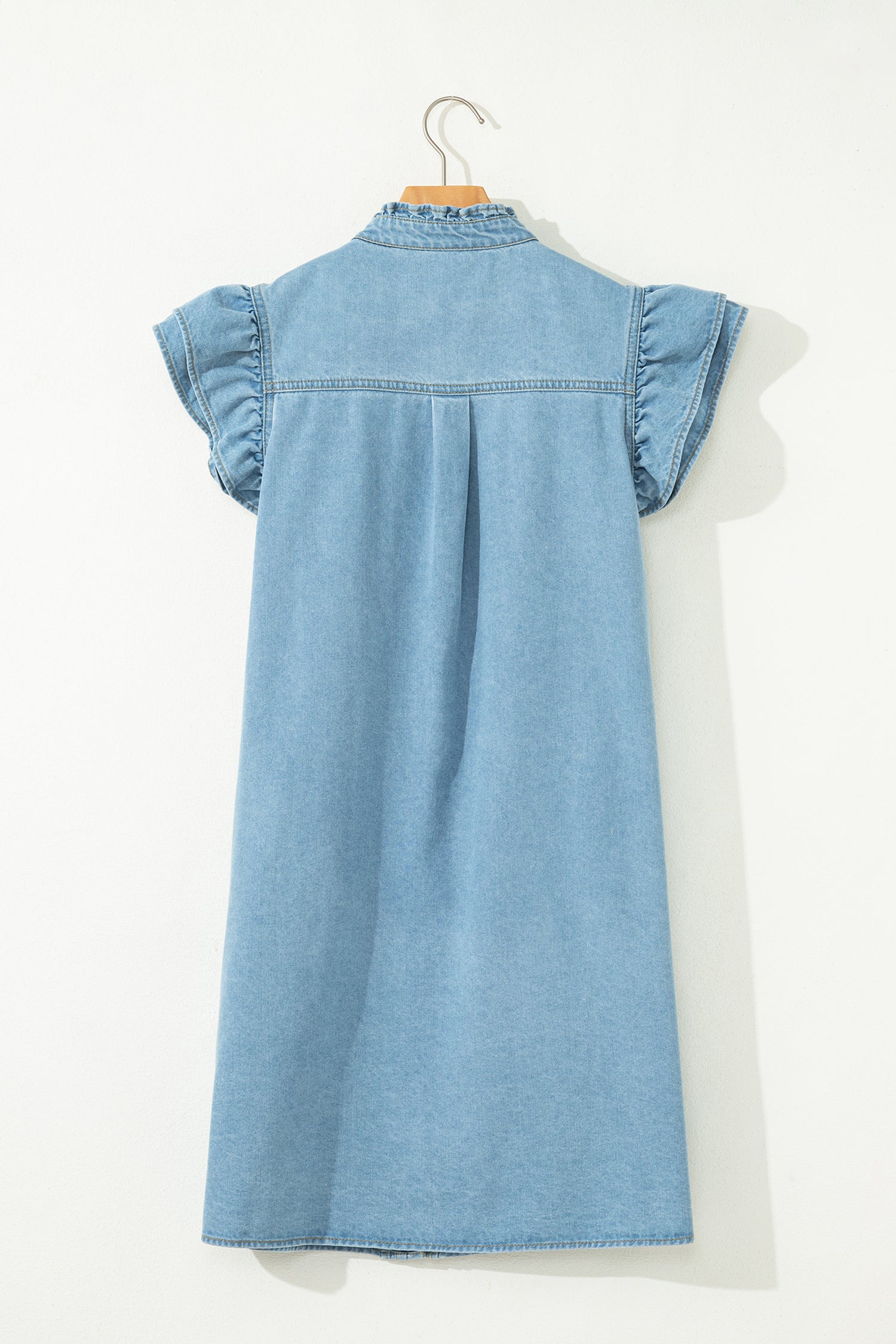 Boutique women’s ruffle sleeve denim dress styled for everyday casual wear back view