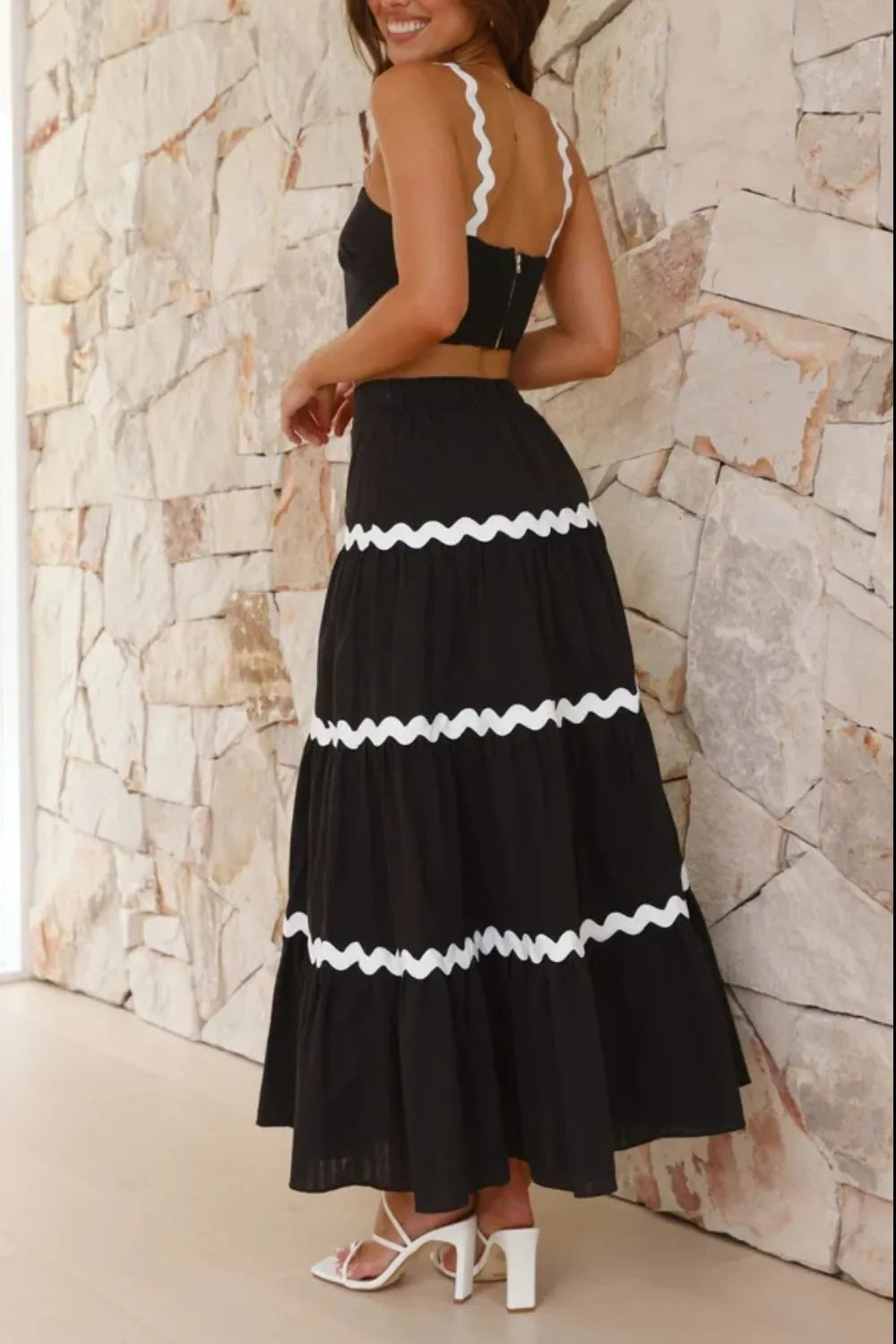 Back view of ric rac two-piece set showing tiered maxi skirt with contrast trim detai