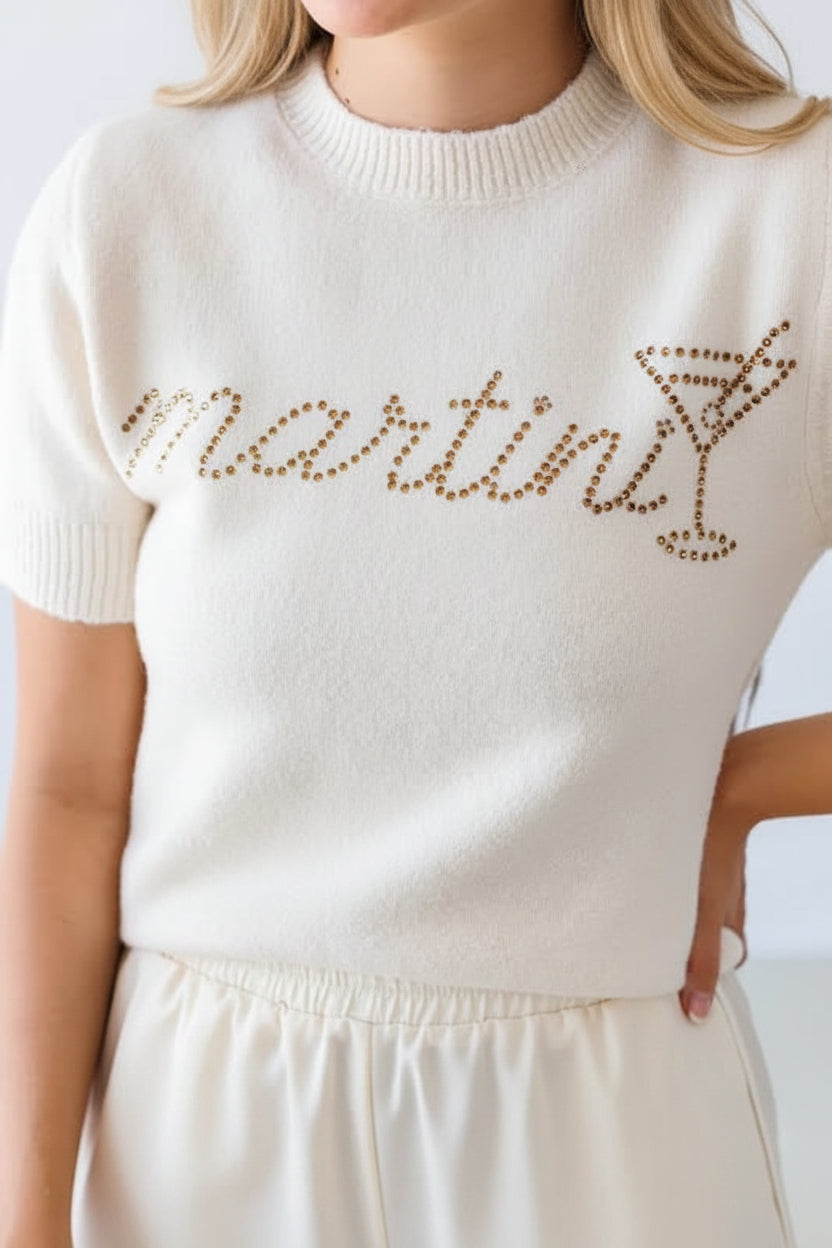 Cream short sleeve knit sweater featuring sparkling rhinestone Martini lettering and cocktail glass detail from Thread Bar Boutique