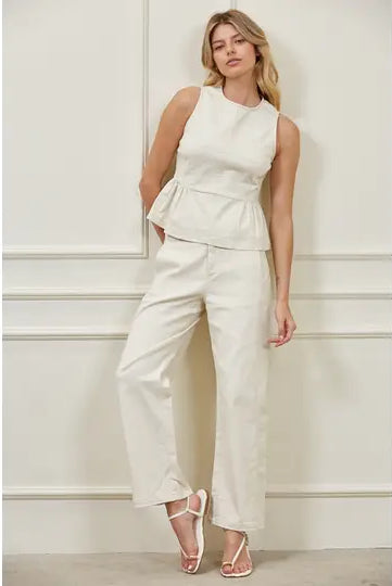 High-waisted barrel leg woven pants with structured waistband, side panel seams, and front pockets, matching peplum top set