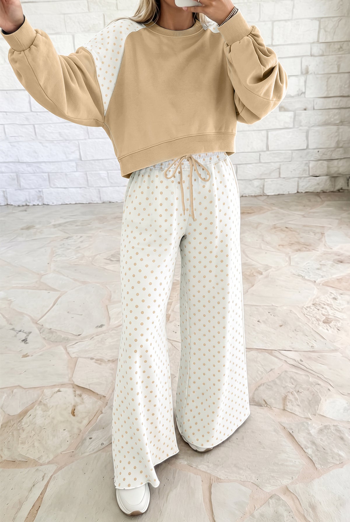 Soft women’s khaki lounge set with a cropped sweatshirt and comfortable wide-leg drawstring pants, featuring a playful polka dot colorblock design for an effortlessly styled look.