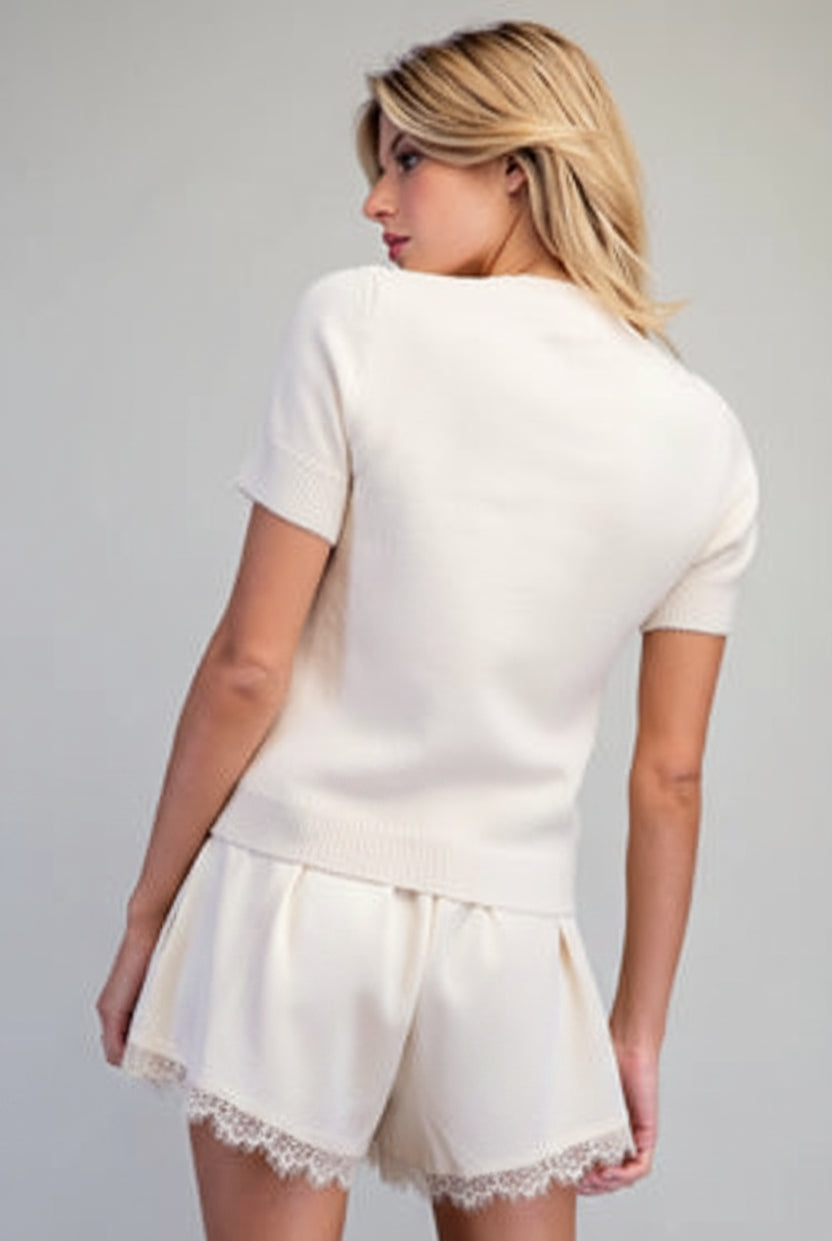 Cropped Martini sweater with rhinestone cocktail glass embellishment, ribbed crew neckline, and short sleeves from Thread Bar Boutique