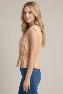 Women's shirred peplum blouse with cap sleeves, round neckline, semi-sheer knit fabric, and flattering fitted bodice.