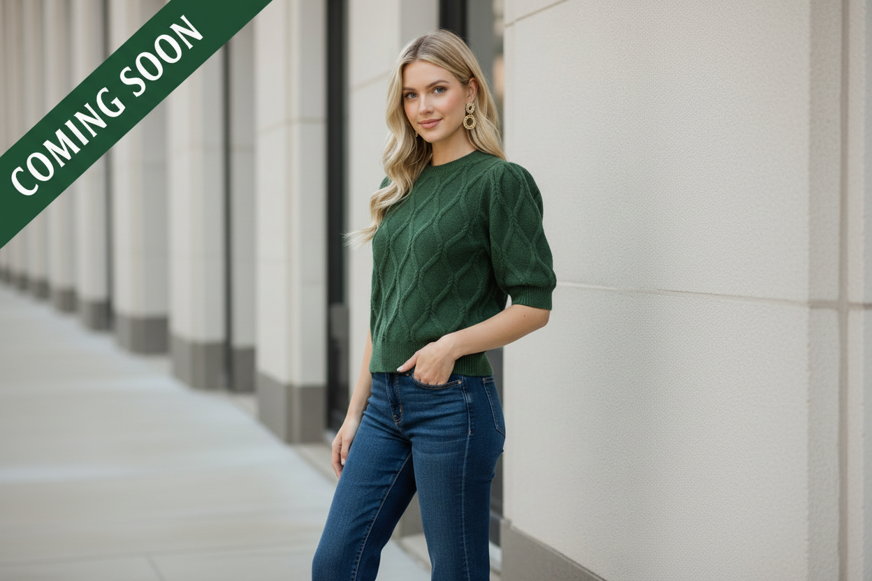 Women's short sleeve cable knit sweater in pine green with voluminous puff sleeves and a relaxed silhouette from Thread Bar Boutique