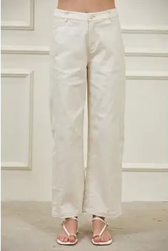 Women’s high-waisted barrel pants in structured woven fabric with tapered leg, visible side seams, and functional pockets
