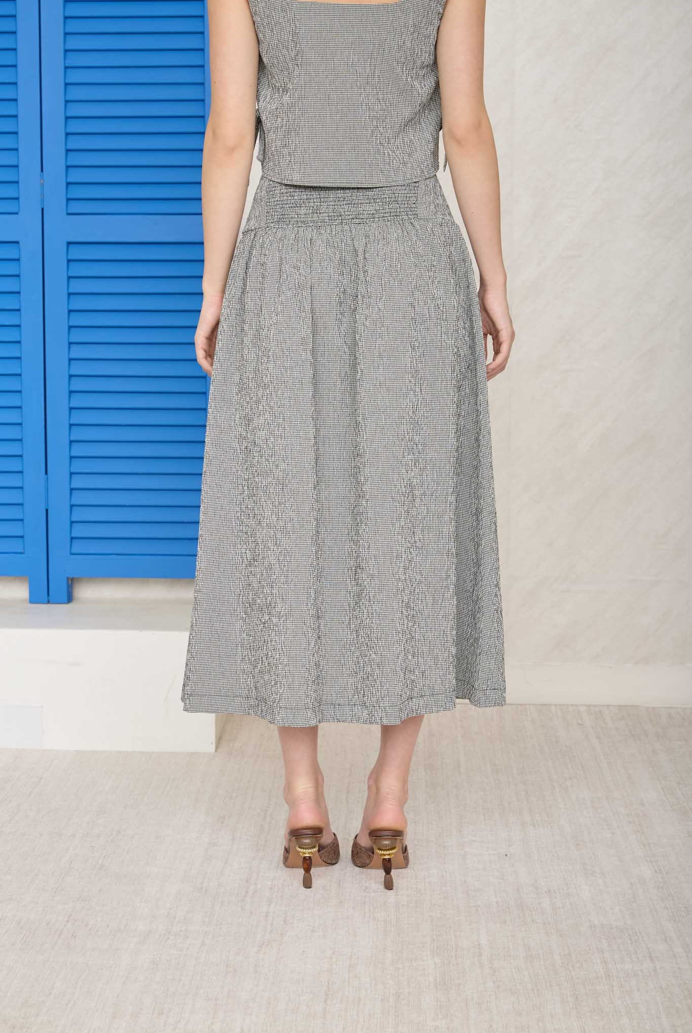 black and white checkered midi skirt. Part of a set with a crop top