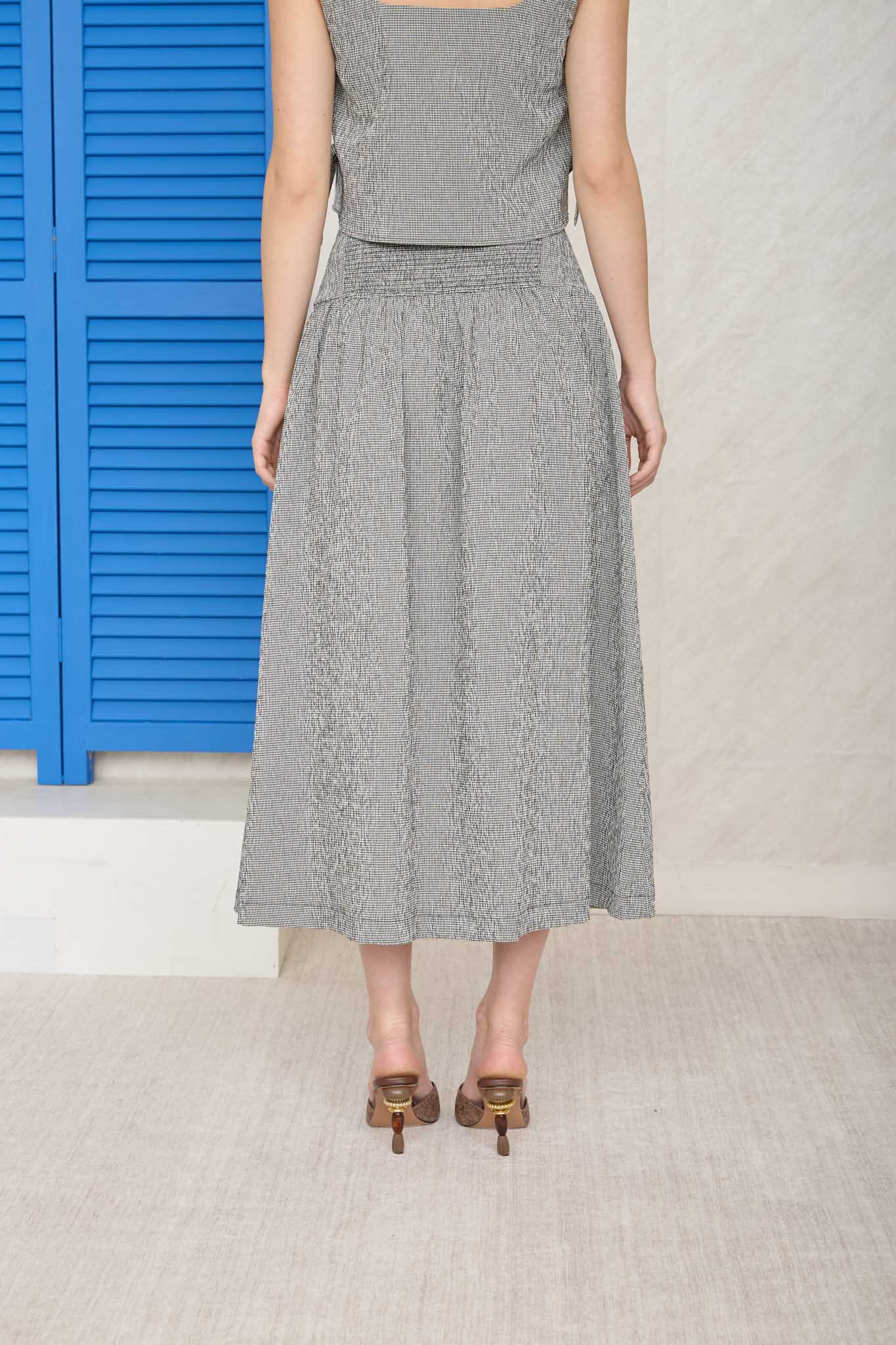 black and white checkered midi skirt. Part of a set with a crop top