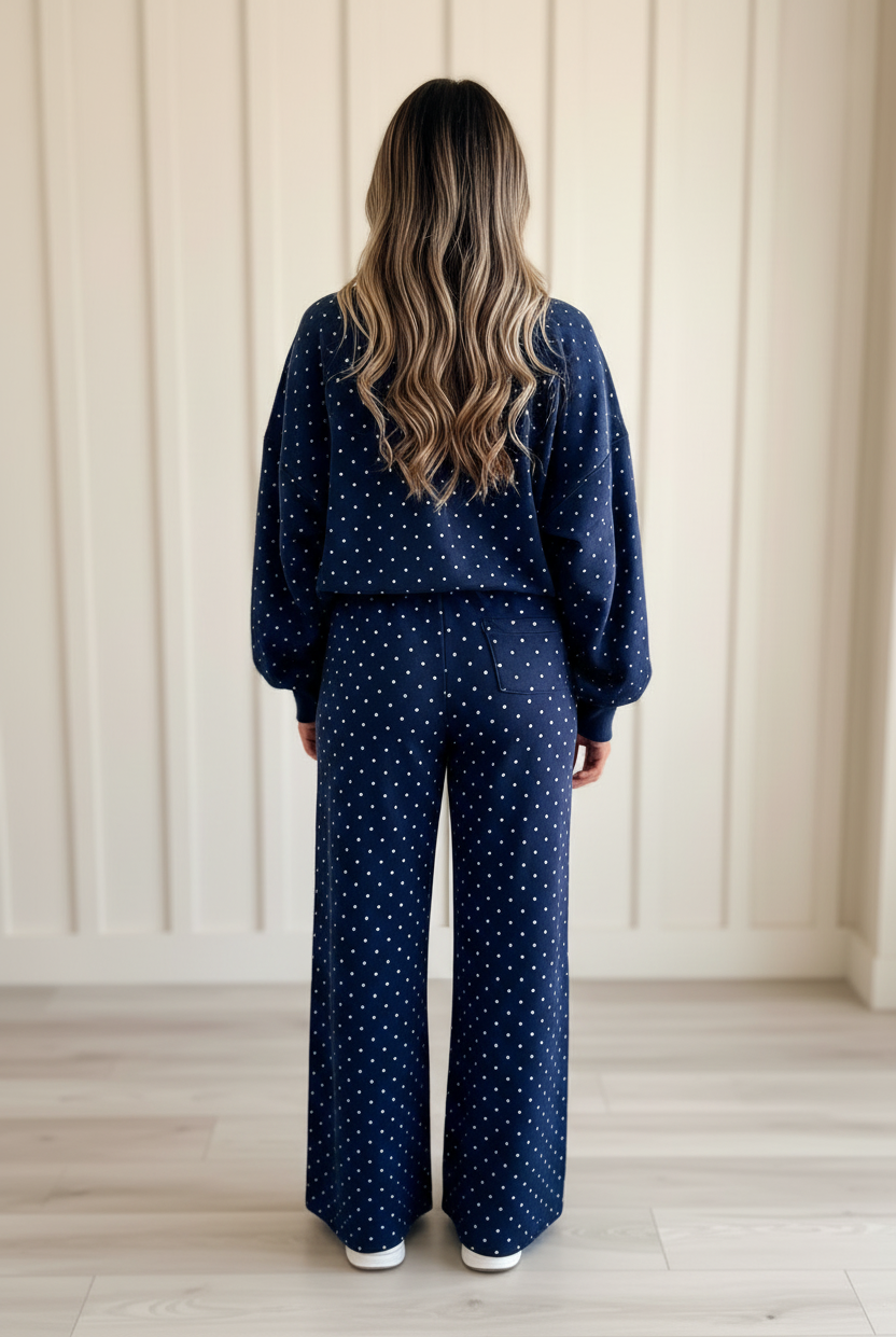Playful polka dot matching two-piece set with lightweight long-sleeve top and relaxed high-waist pants for an effortless casual look