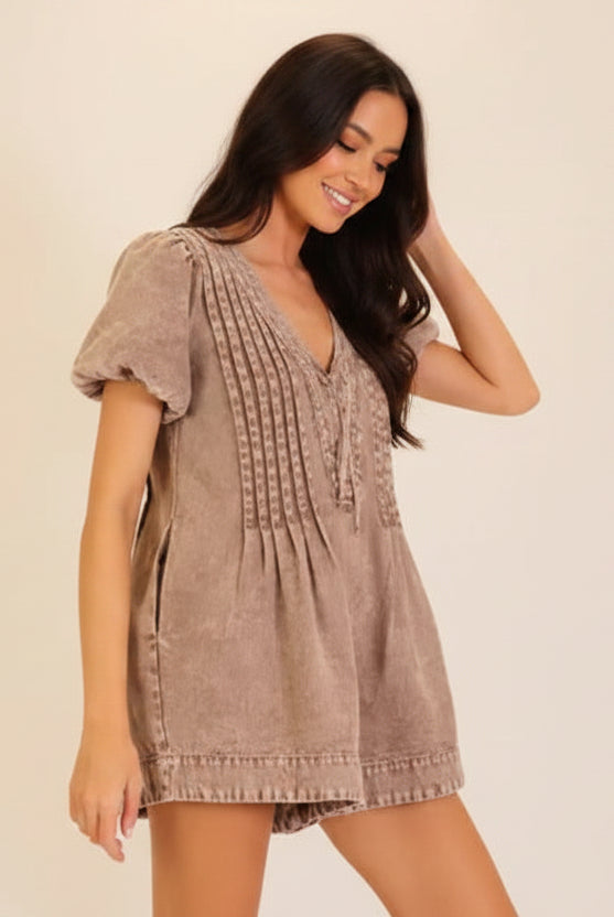 Washed utility romper with deep V neckline, front tie, short sleeves, and relaxed fit from Thread Bar Boutique