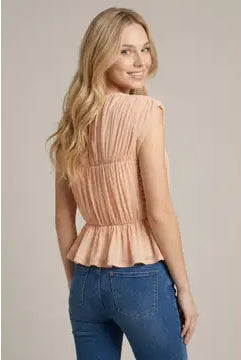 Lightweight women's peplum knit top featuring shirred detailing, cap sleeves, round neckline, and button-back closure.