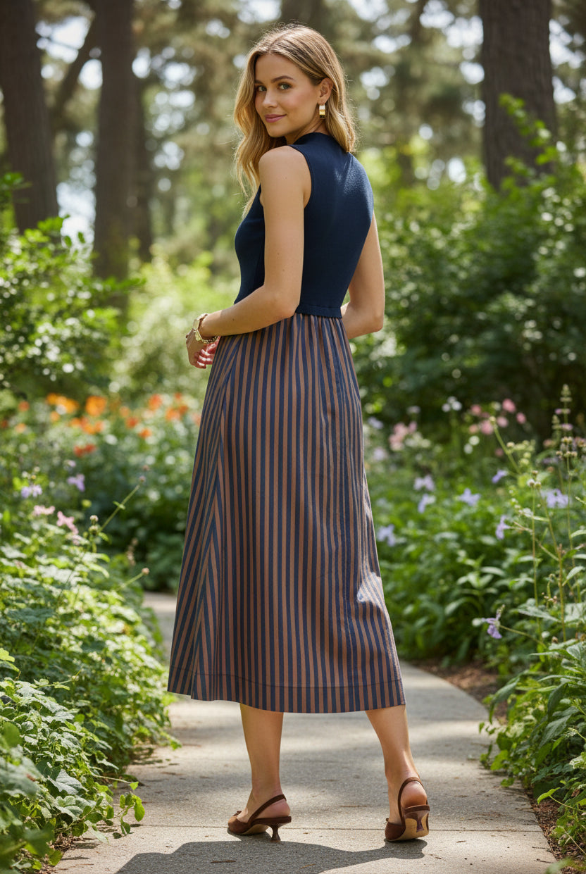 Women's work-to-dinner midi dress featuring a polished mock neck bodice, contrast vertical striped skirt, sleeveless silhouette, and relaxed fit for office, events, and dinner outfits.