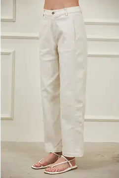 Modern women’s woven barrel pants featuring a high waist, relaxed hip and thigh, tapered hem, and sculptural side panel seams