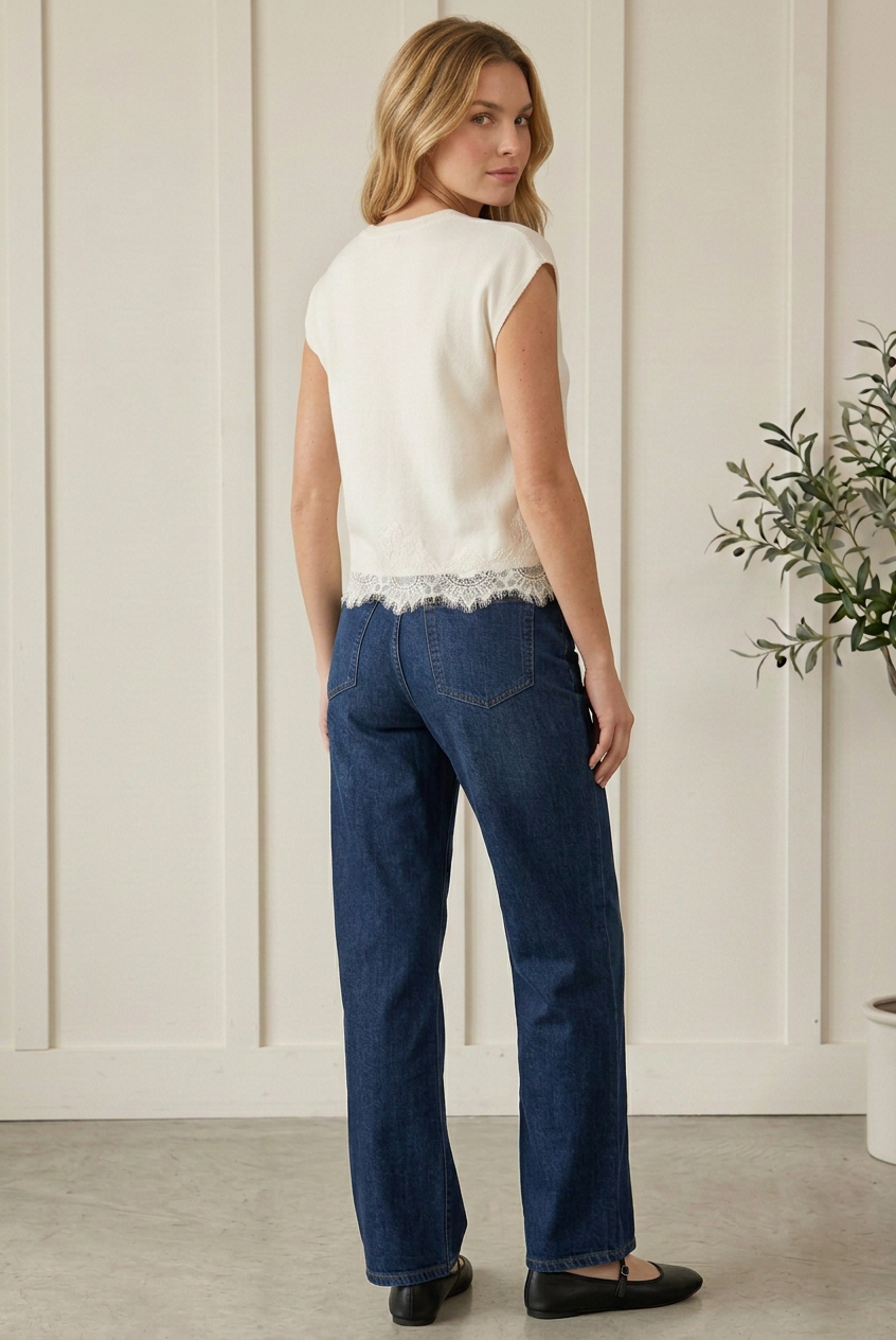 ack view of Entro cream cap sleeve knit top showing a plain knit back and delicate eyelash lace trim hem.