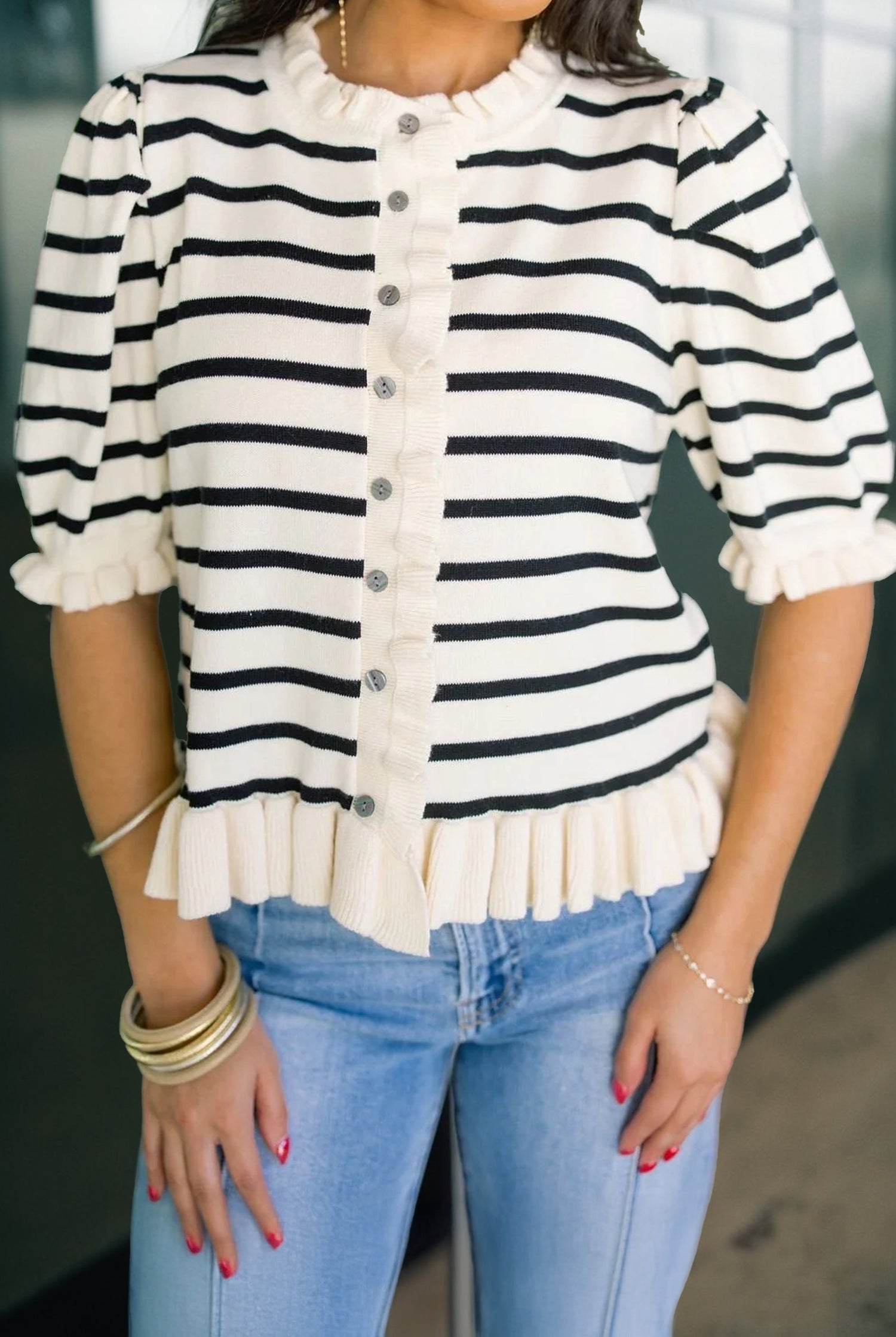 Lightweight beige stripe knit cardigan with feminine ruffle trim and short sleeves