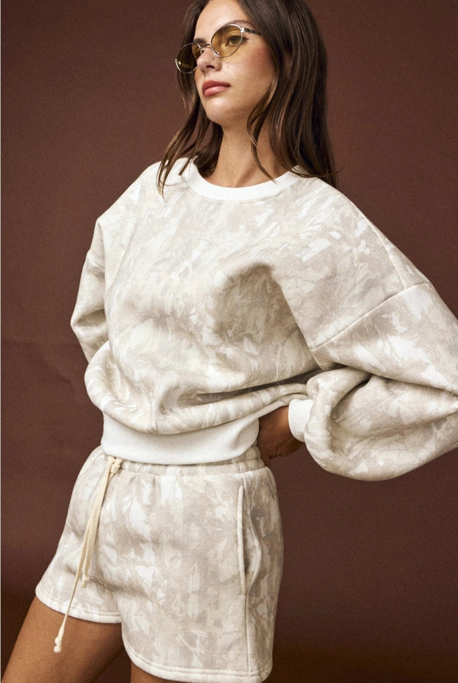 Camo high-waisted drawstring shorts, part of a coordinated camo sweat set with a matching crewneck