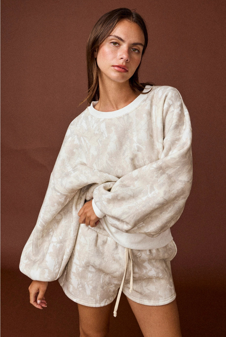 Camo high-waisted drawstring shorts, part of a coordinated camo sweat set with a matching crewneck