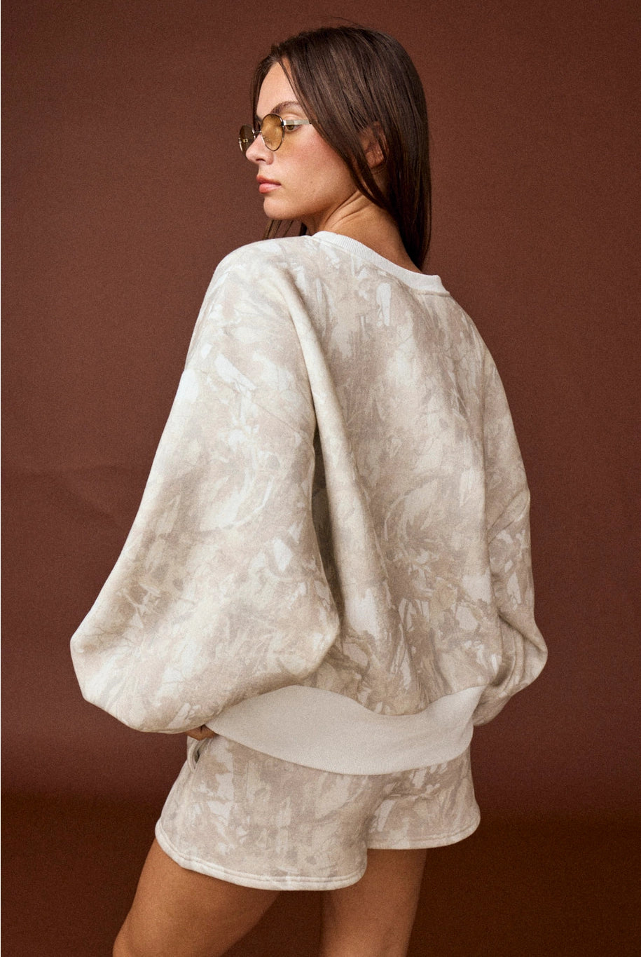 Camo high-waisted drawstring shorts, part of a coordinated camo sweat set with a matching crewneck