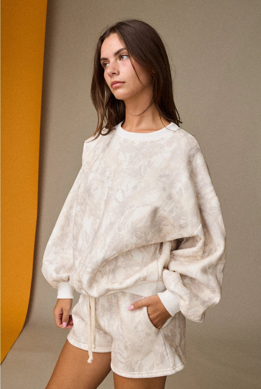 Woodland camo oversized crewneck sweatshirt, part of a matching camo sweat set with coordinating shorts.”