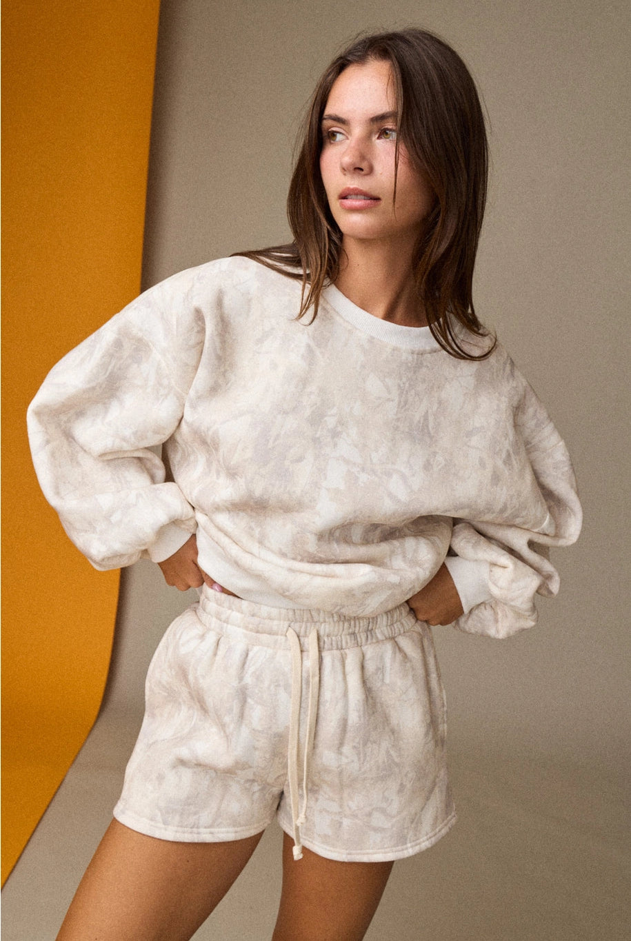 Woodland camo oversized crewneck sweatshirt, part of a matching camo sweat set with coordinating shorts.”