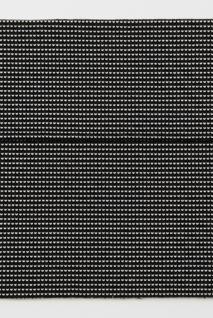 Black and white micro-stripe fabric flat lay swatch