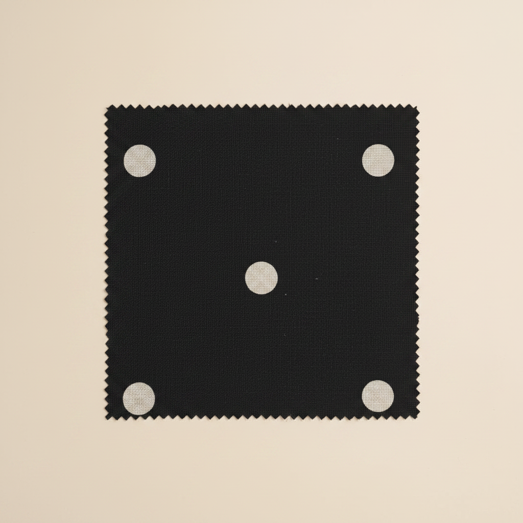Black fabric with white polka dots flat lay swatch