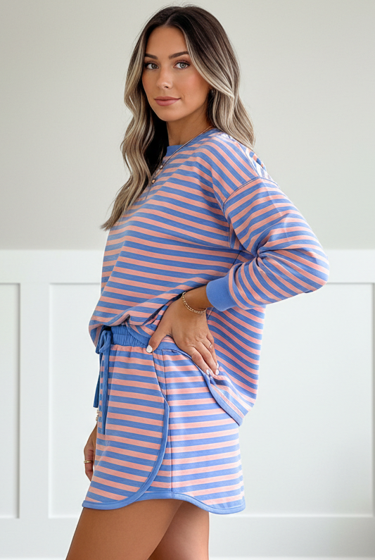 Women’s blue striped pullover and mini skort set with built-in shorts