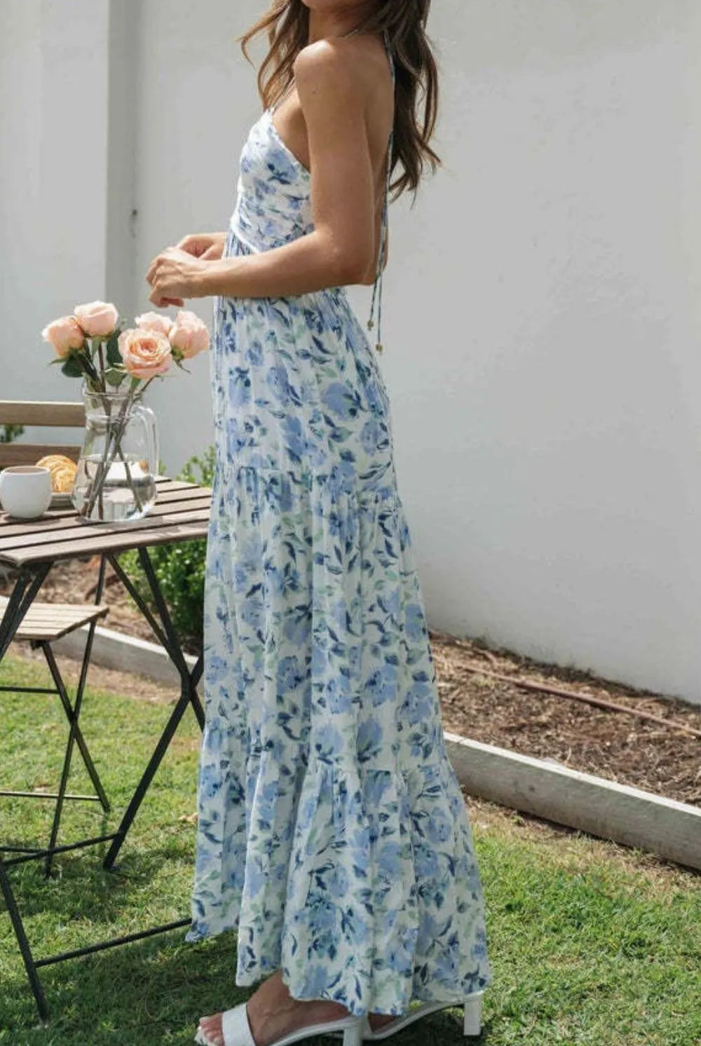 Floral halter midi dress from Thread Bar Boutique featuring ruched front, open tie back, and flowy feminine silhouette