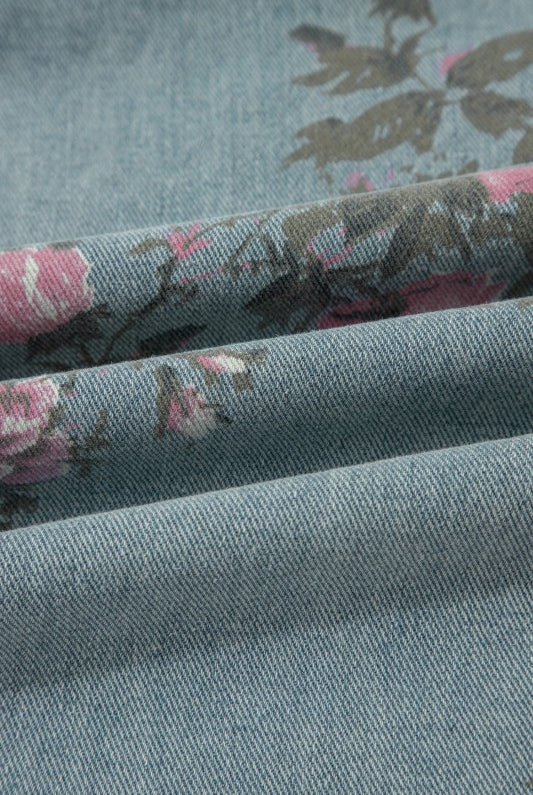 Pink and sage floral print denim overalls from Thread Bar Boutique with pleated detailing and relaxed wide leg silhouette. Fabric close up