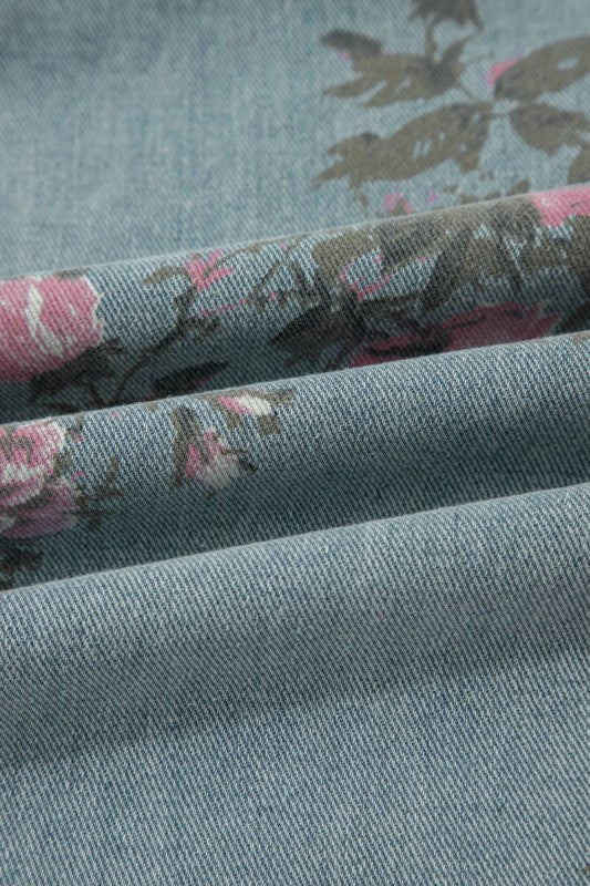 Pink and sage floral print denim overalls from Thread Bar Boutique with pleated detailing and relaxed wide leg silhouette. Fabric close up