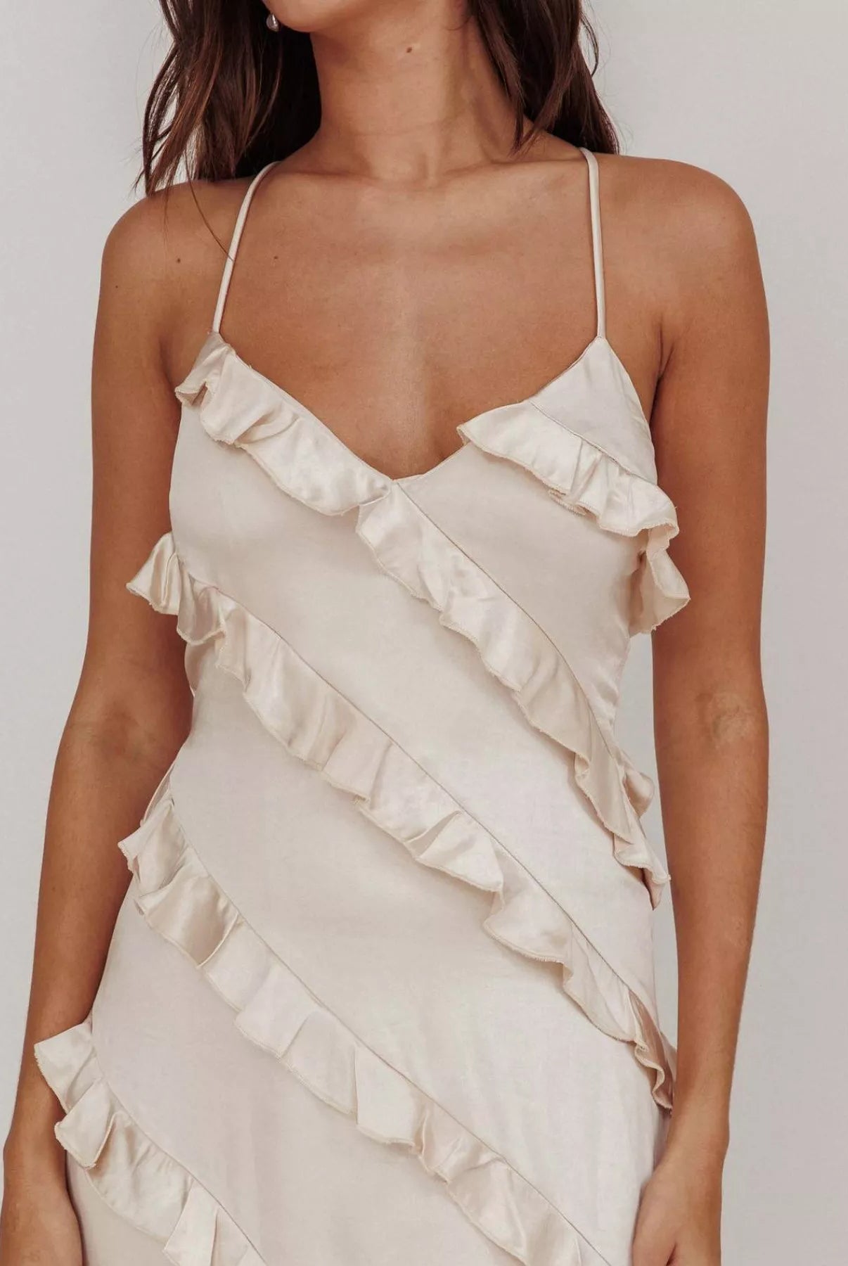 close up cream Ruffled spaghetti strap maxi dress with flowy silhouette, lightweight fabric, and feminine drape