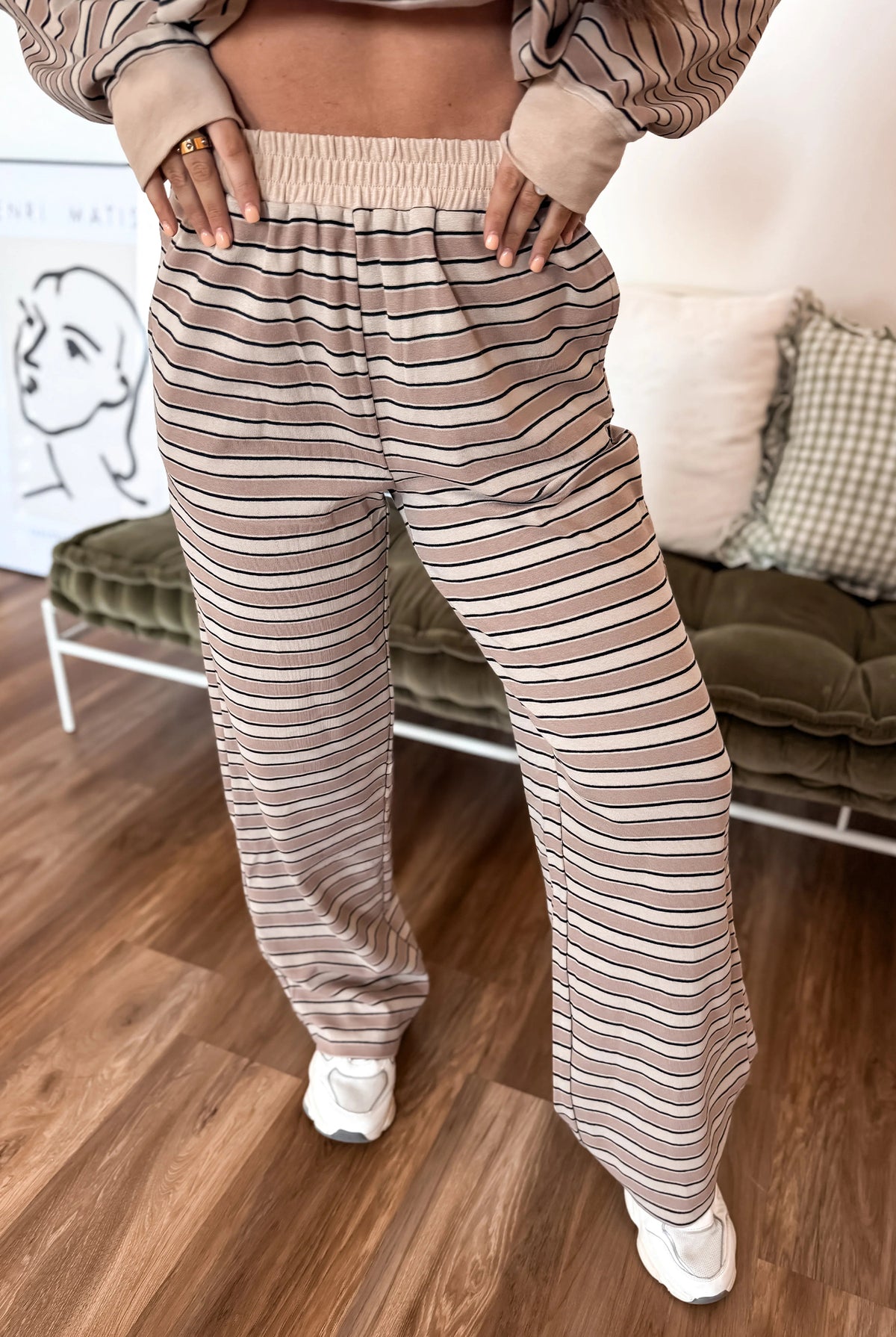 Casual khaki striped two-piece outfit with relaxed-fit long-sleeve top, round neckline, and matching wide-leg pants with elastic waistband