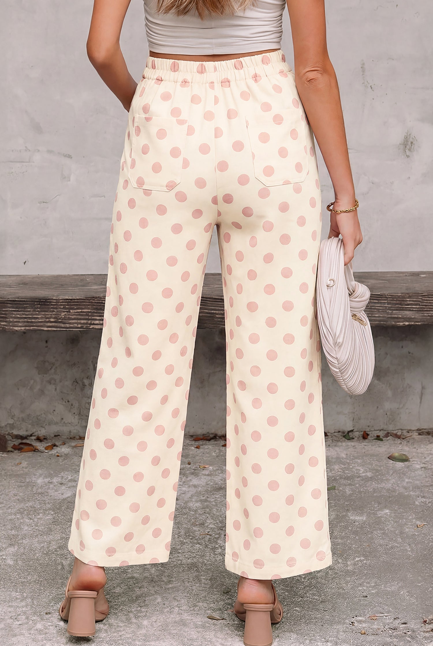 Retro-inspired polka dot wide-leg trousers in a soft cream fabric with relaxed fit and comfortable elastic waistband