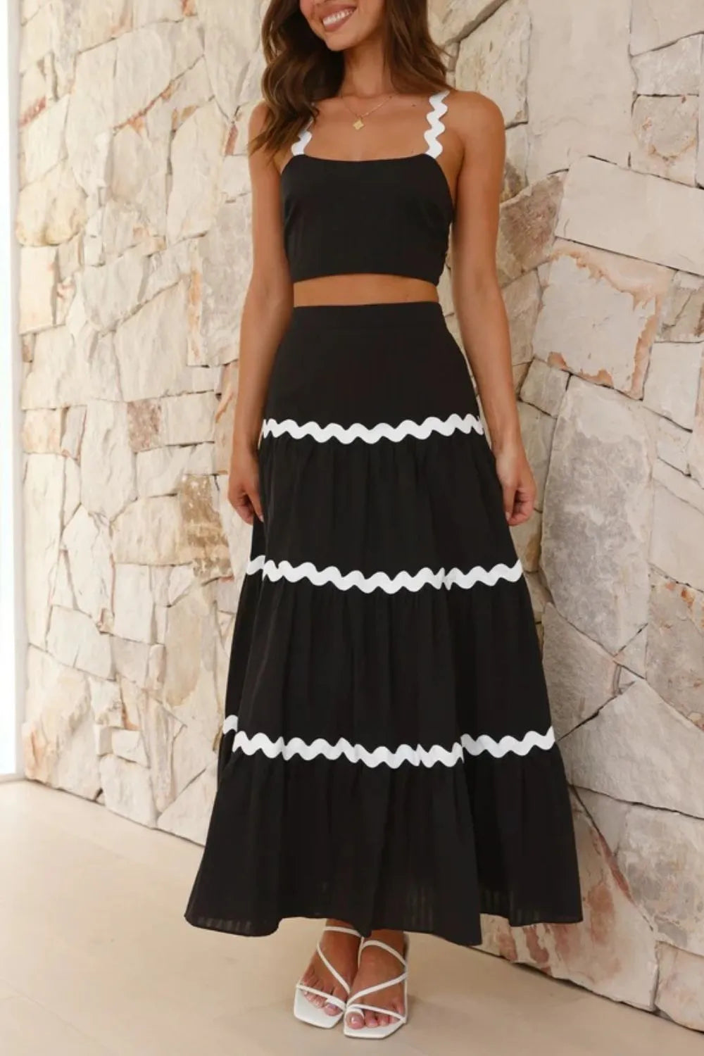 Close-up of scalloped ric rac straps on black crop top
