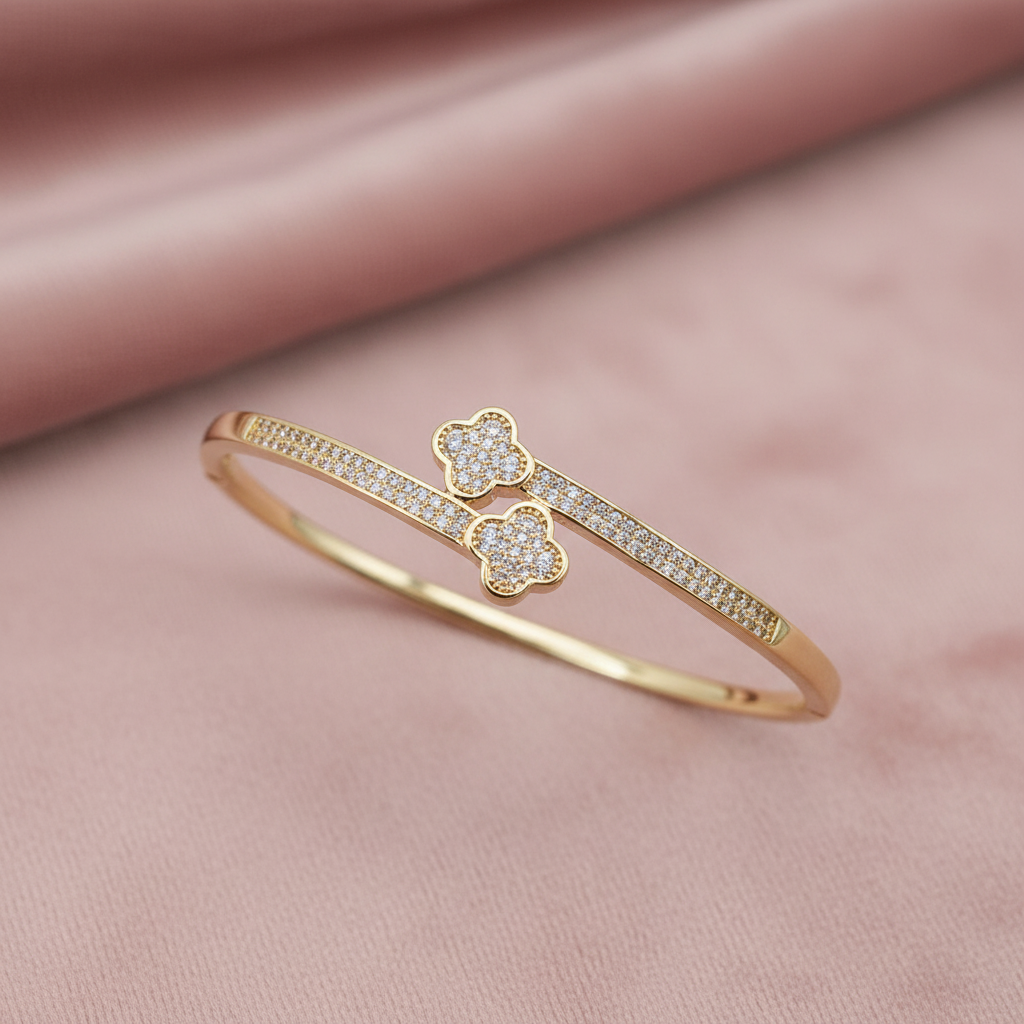 Minimalist clover bangle bracelet with cubic zirconia accents and polished silver finish