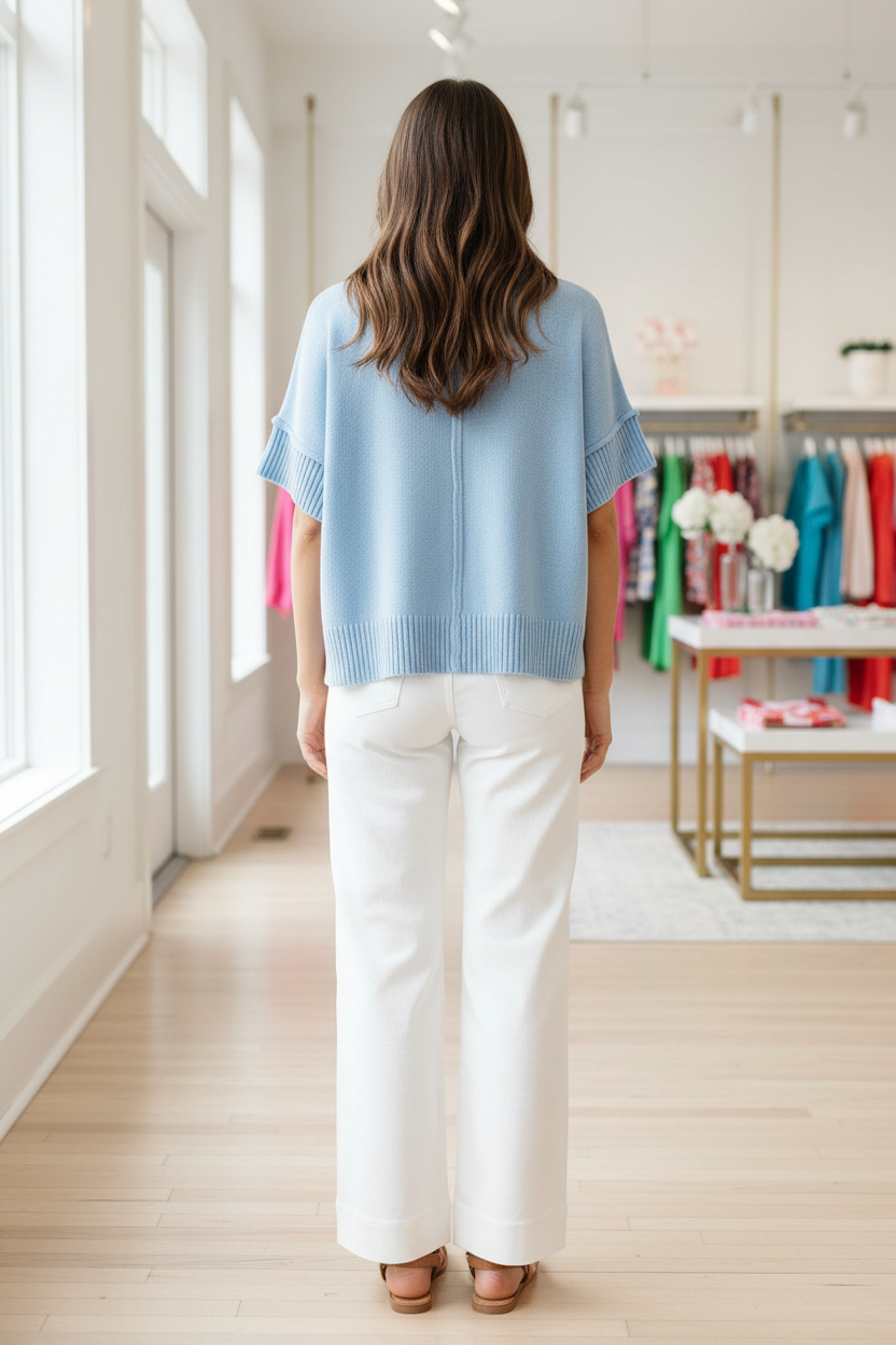 Relaxed fit blue knit top with drop shoulders and casual oversized silhouette
