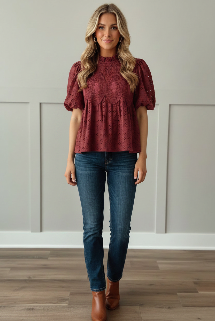 Cranberry burgundy 100% cotton eyelet puff sleeve blouse with ruffled mock neckline and ornate crochet medallion detail on front bodice, front view