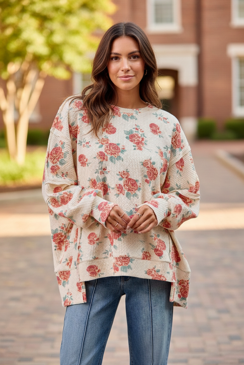 Oatmeal rose floral print oversized waffle knit sweatshirt full body front view, crew neckline, balloon sleeves, side slits, styled with blue denim jeans