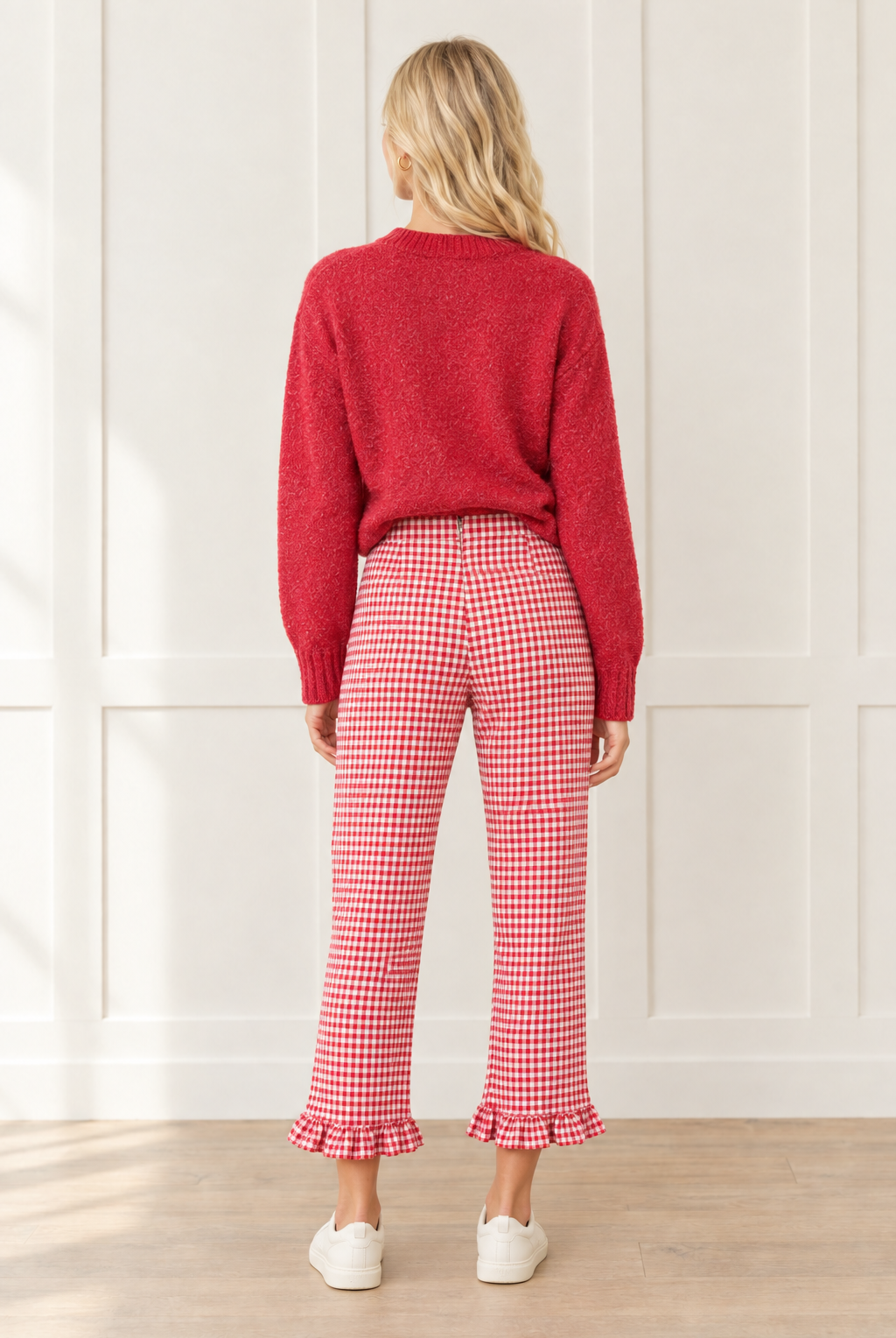 Back view of red and white gingham pants showing the high waistband, center back seam, straight cropped legs and matching ruffle hems.