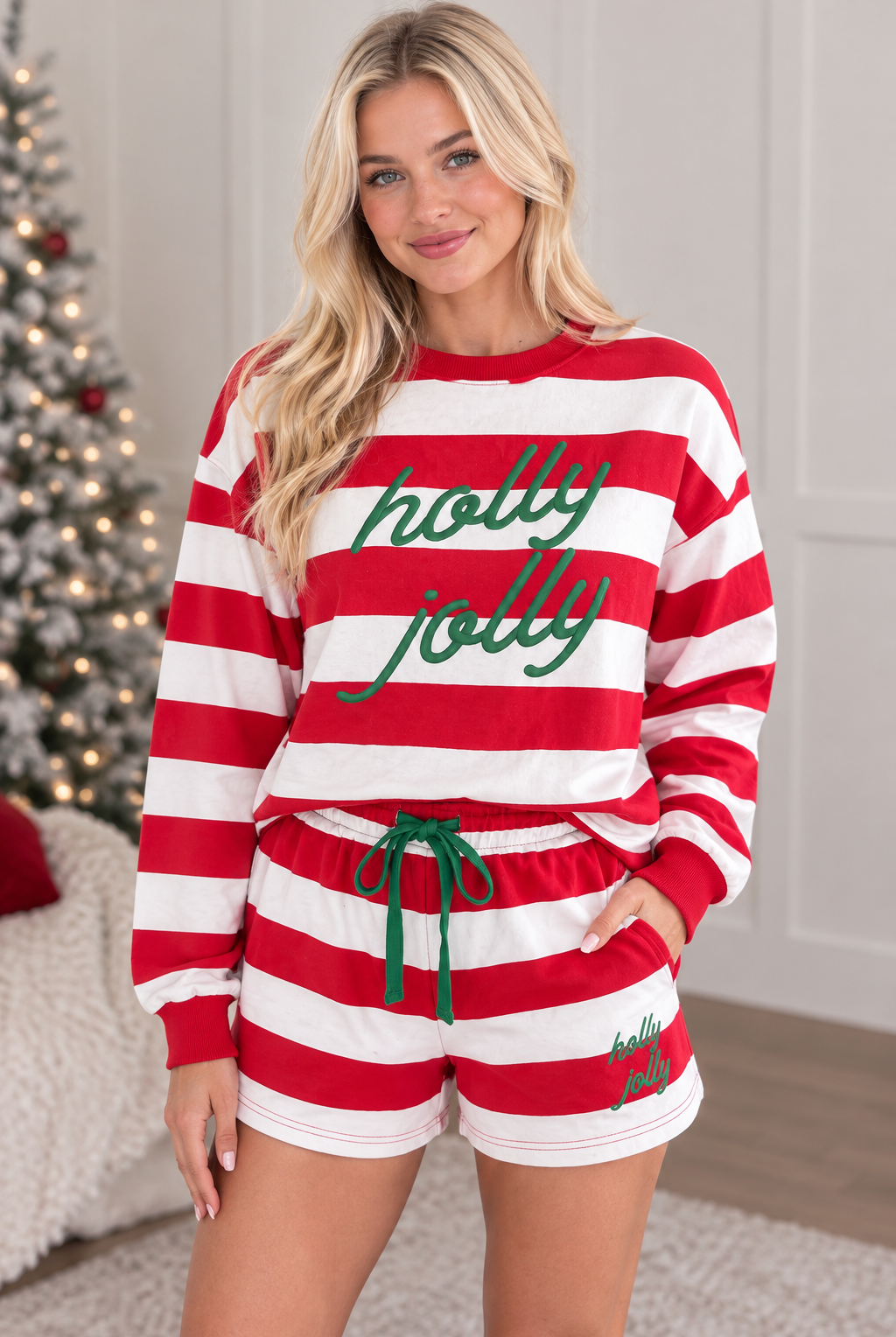 Three quarter view of red stripe Holly Jolly long sleeve pullover and matching holiday shorts