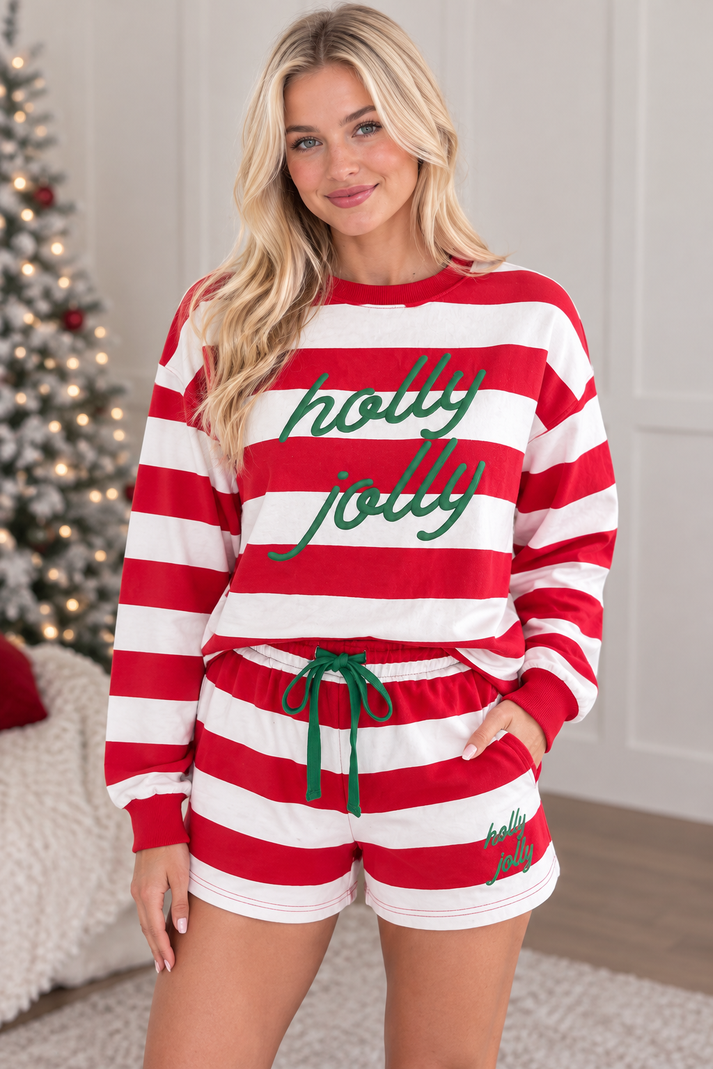 Three quarter view of red stripe Holly Jolly long sleeve pullover and matching holiday shorts