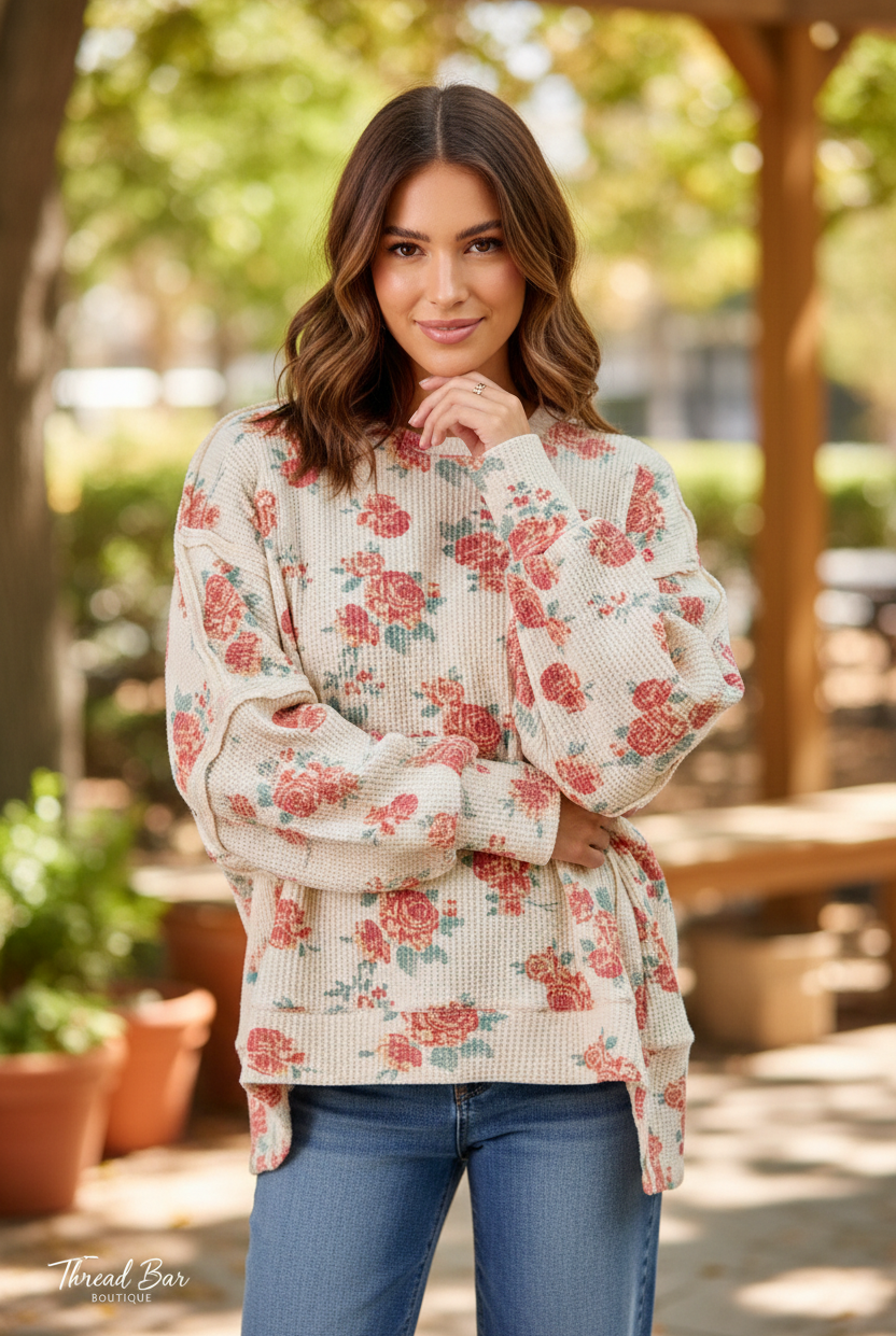 Oatmeal floral print oversized waffle thermal sweatshirt full body lifestyle shot, crew neck, exposed seam detailing, relaxed fit styled with blue denim jeans