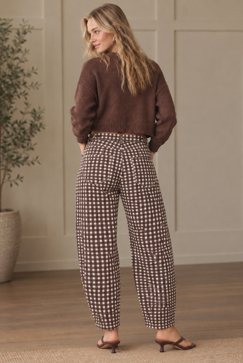 Brown and cream gingham barrel pants showing back patch pockets, belt loops and curved legs with tapered hems.